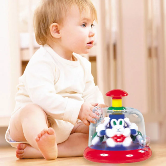 اسباببازی با یک گردونه به همراه چهار عروسک خرگوش رنگی درون حباب